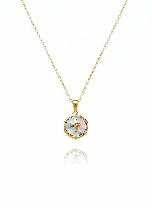 A 24K gold-filled mother-of-pearl n
ecklace with a gold cross charm in a circular frame, attached to a delicate gold chain.