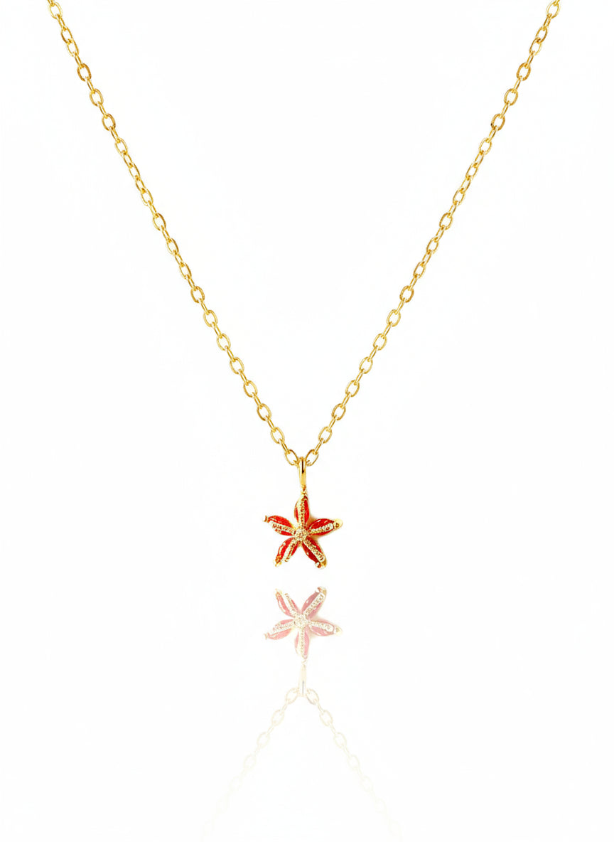 A 14K gold-filled dainty starfish necklace with a gold chain and two starfish charms as described in the product description.