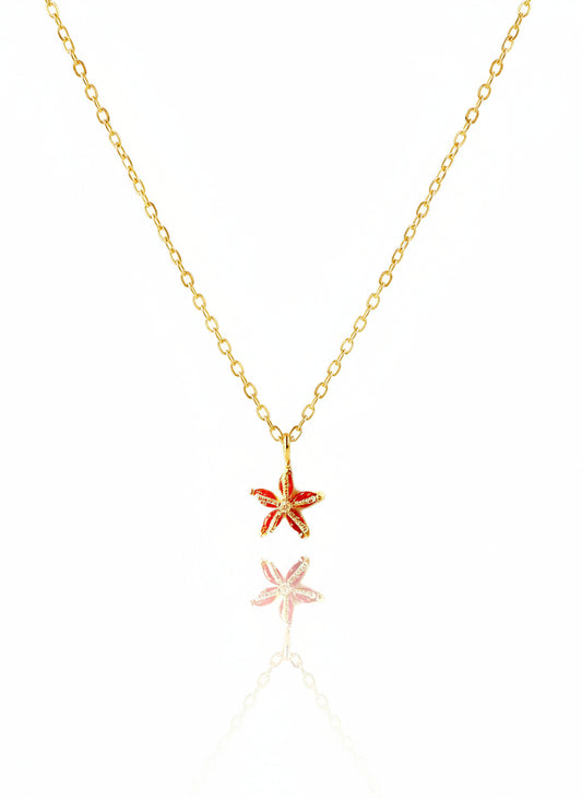 A 14K gold-filled dainty starfish necklace with a gold chain and two starfish charms as described in the product description.