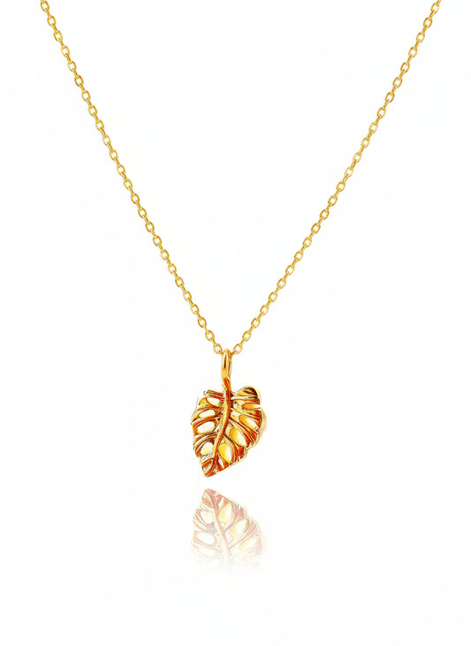 A gold-filled monstera leaf necklace with a 14K gold filled 17" chain and 2" extender.