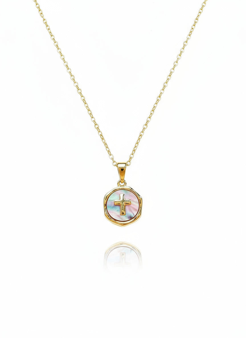 A 24K gold-filled mother-of-pearl n
ecklace with a gold cross charm in a circular frame, attached to a delicate gold chain.