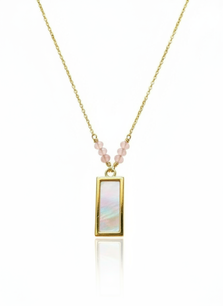 Necklace with a rectangular pendant and pink beads on a white background