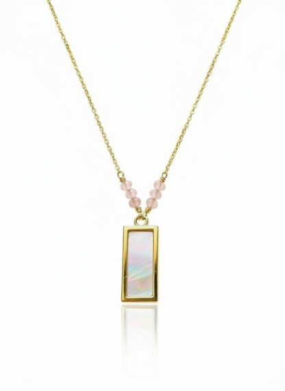 Necklace with a rectangular pendant and pink beads on a white background