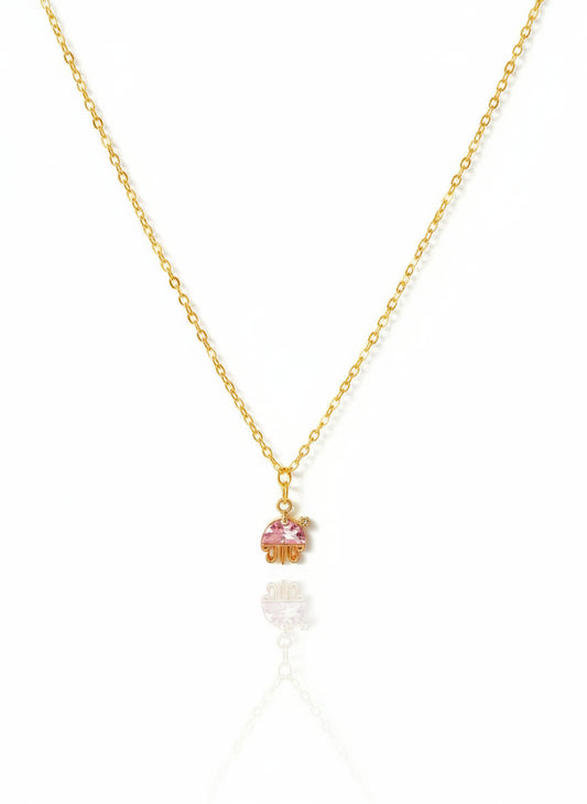 Necklace with a small pink jellyfish pendant on a white background