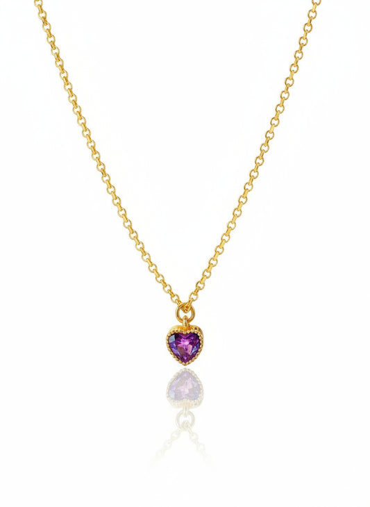 A gold-filled necklace with a heart-shaped pendant featuring purple and pink crystals.