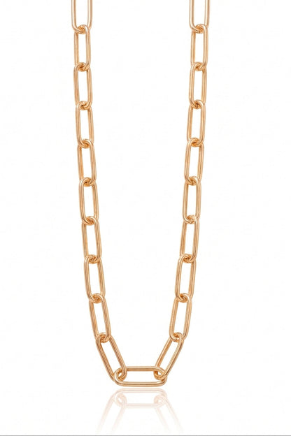 A rose gold paperclip chain necklace displayed vertically against a clean white background with a subtle reflection at the bottom.
