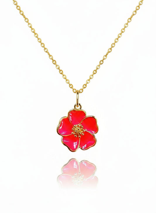 A gold-filled necklace with a pink hibiscus flower pendant on a white background.